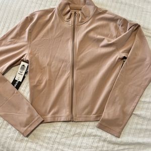 Never worn tags on TNA butter limited edition zip size L/G